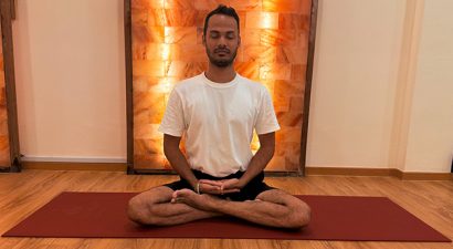 A person in pose during a guided Yoga Nidra session for insomnia in a serene studio in Singapore.